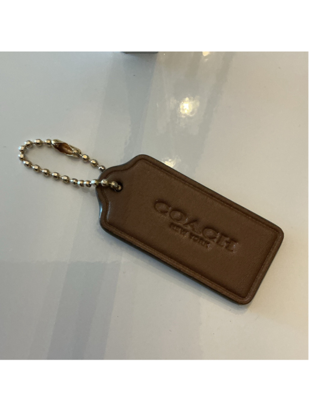 Coach Brown Bag Tag